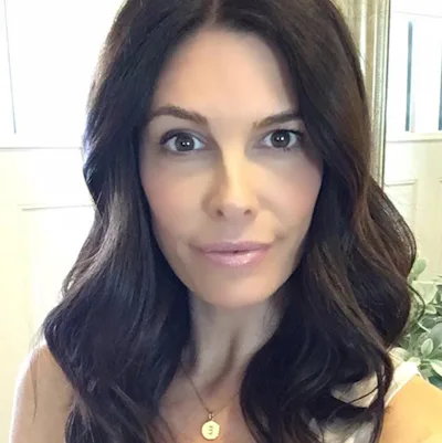 woman with black hair color from Madison Reed