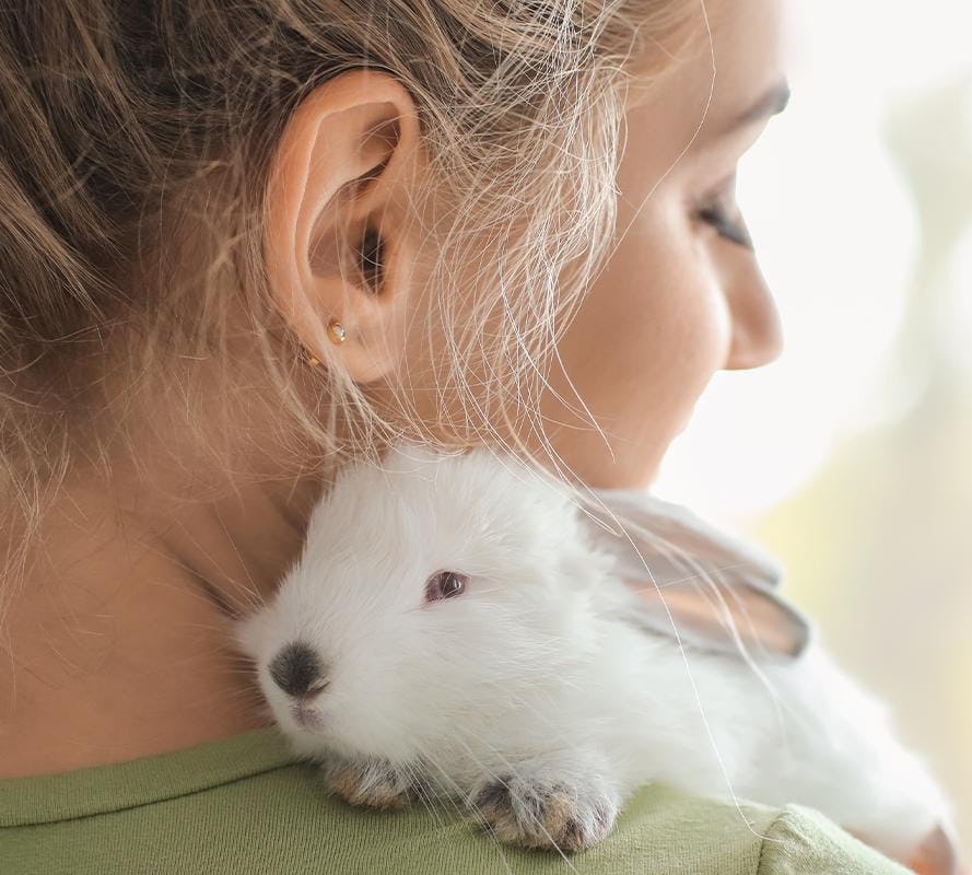 Bunny on woman's shoulder for Madison Reed's Leaping Bunny Certification