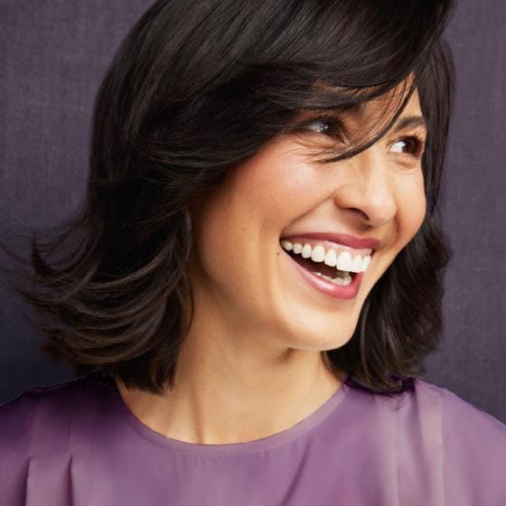 Woman with black hair, laughing