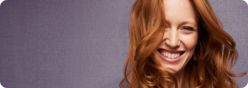 Woman with red hair, smiling